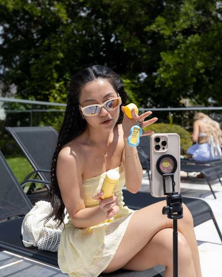 Creator recording poolside content